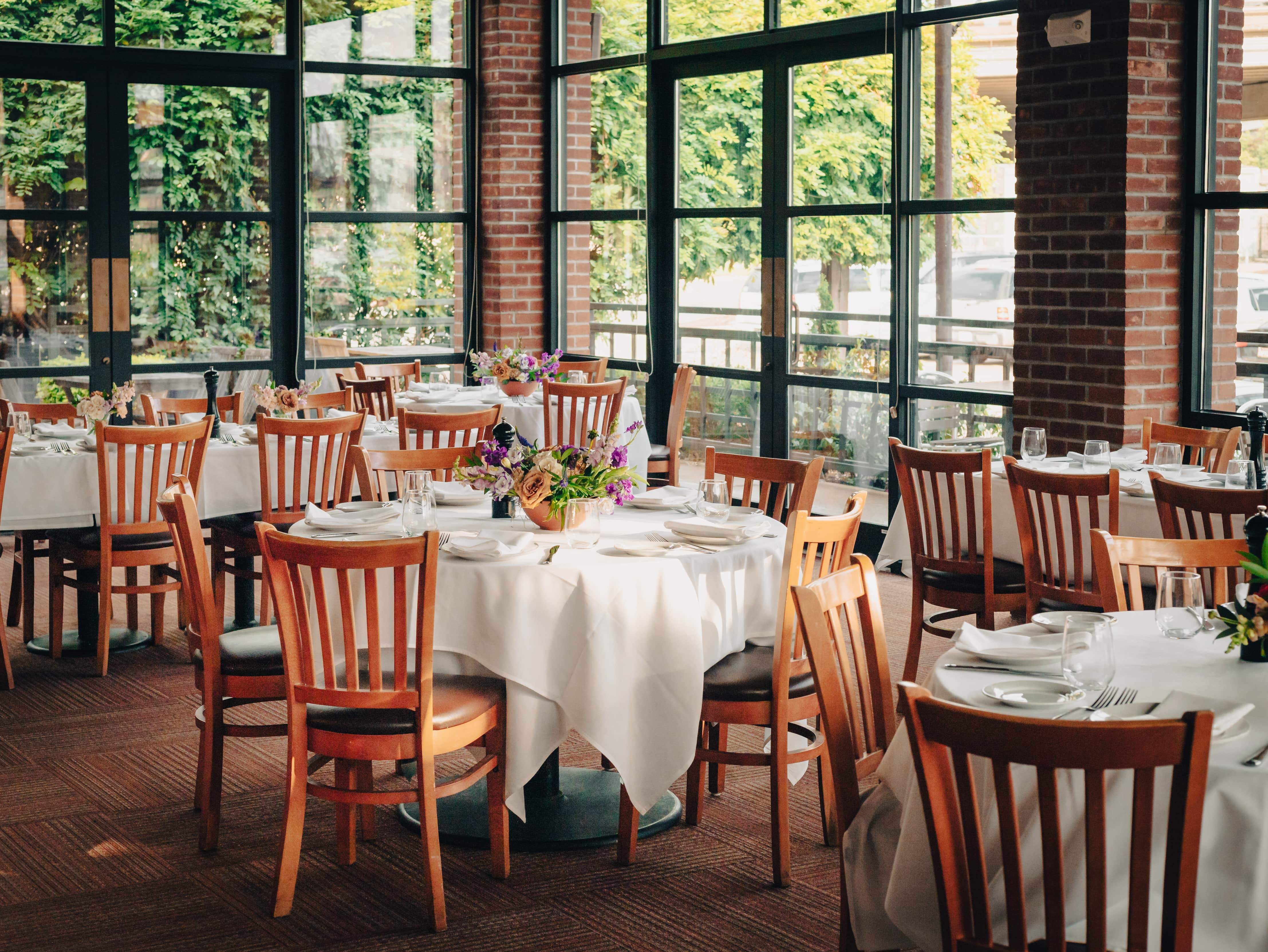 a dining room table in front of a window
