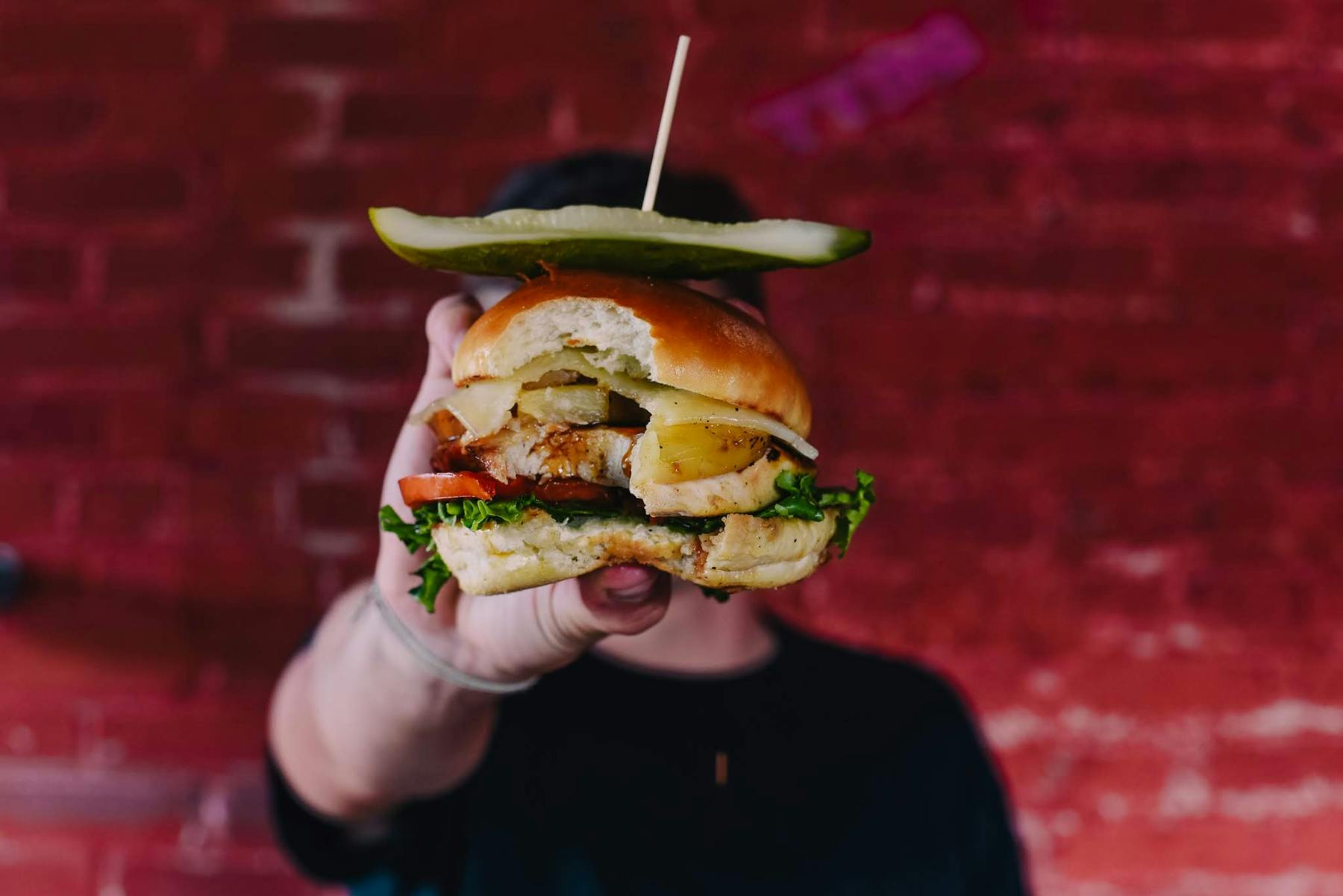 a man holding a burger