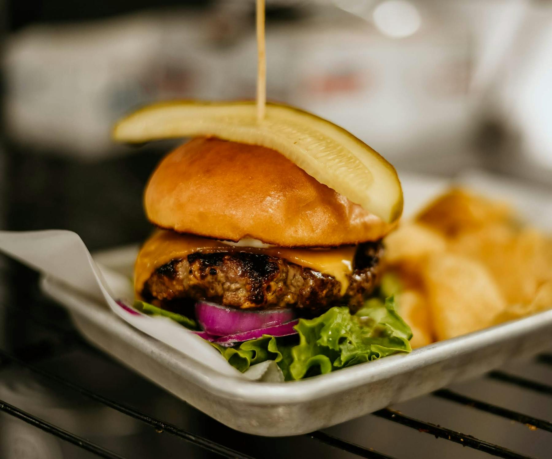 a close up of a burger sitting on top of a table