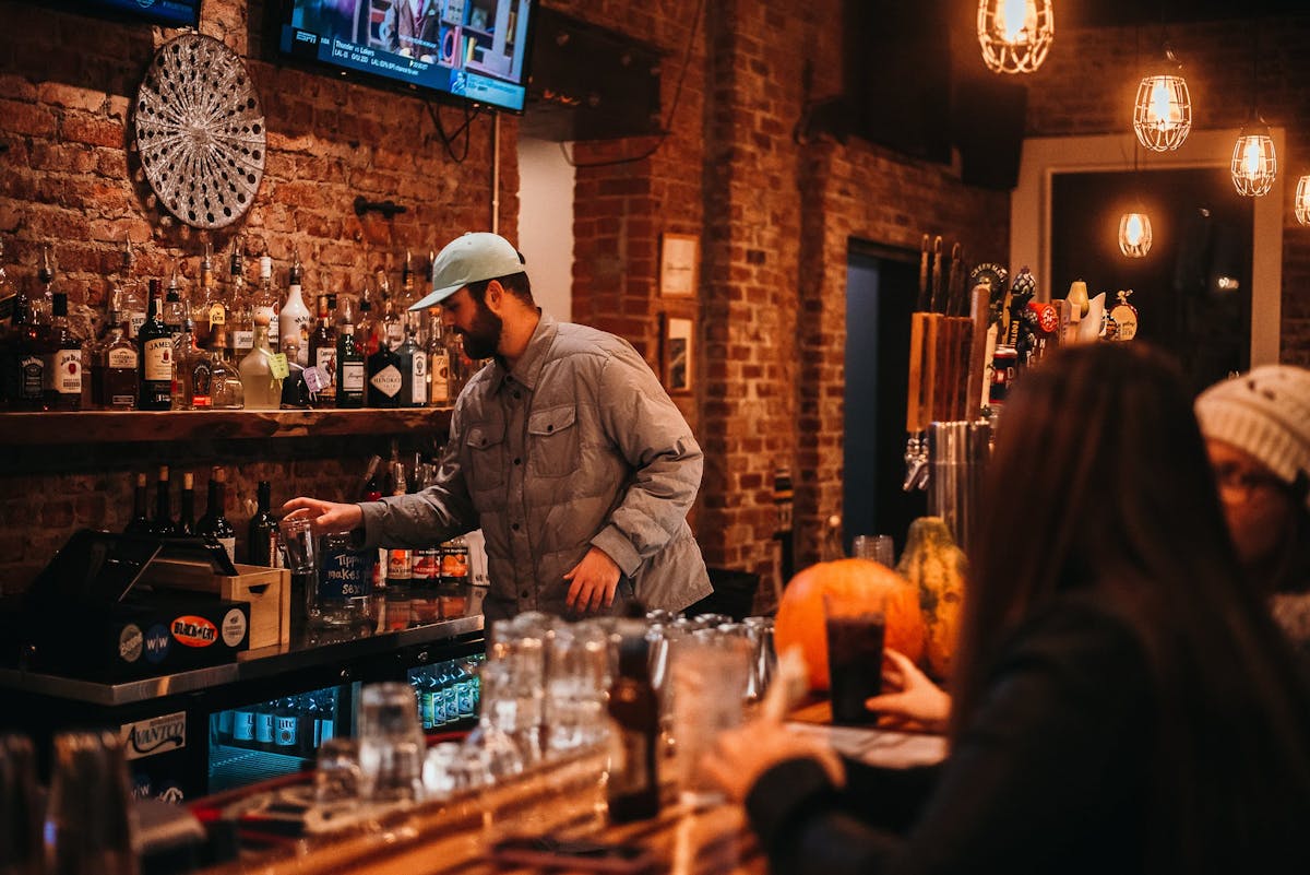 a man standing in the bar