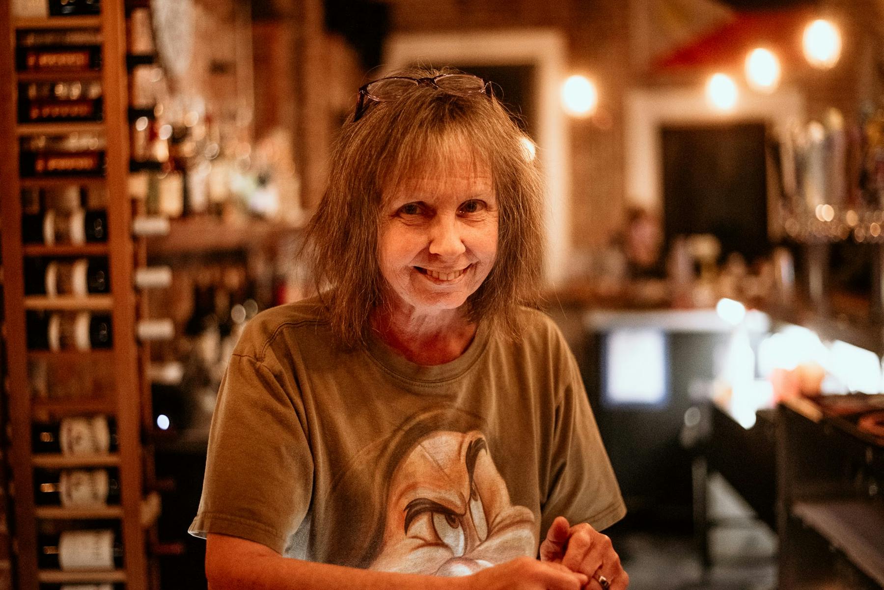 a person sitting at a table in a restaurant