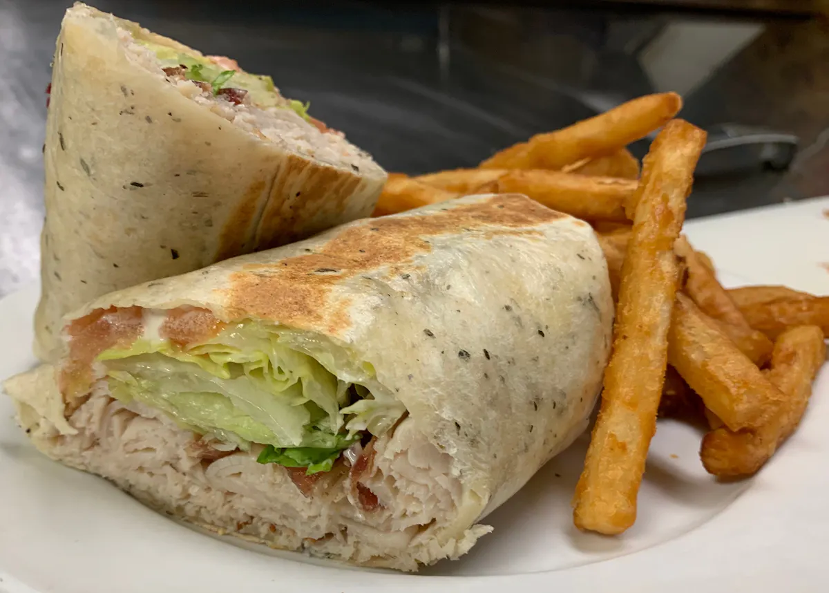 a chicken sandwich and fries on a plate