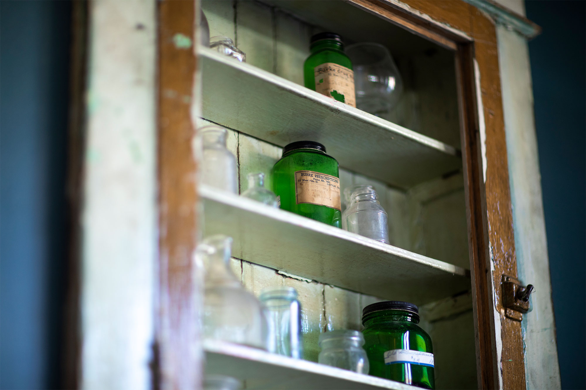 a close up of a bottle and a mirror
