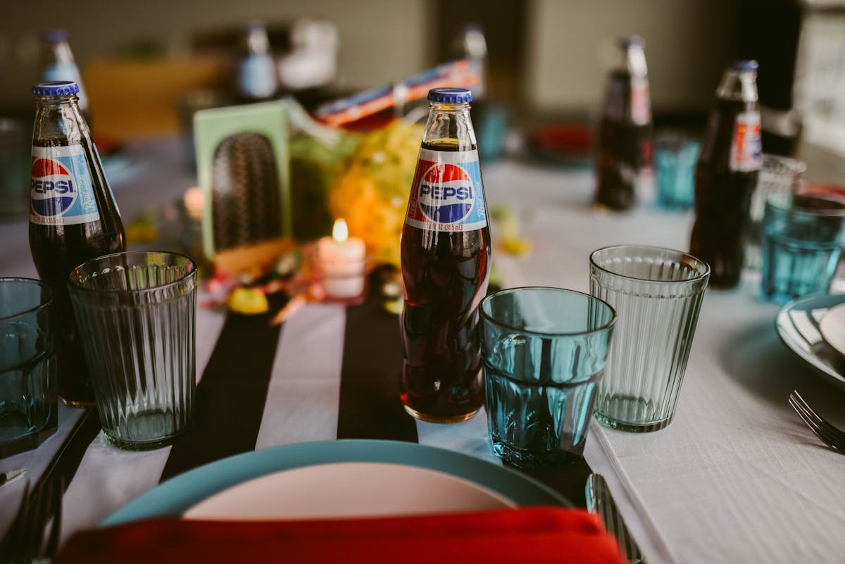 a bottle and a glass of beer on a table