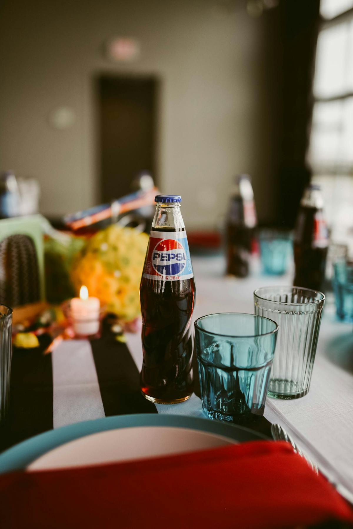 a close up of a bottle and a glass of beer on a table