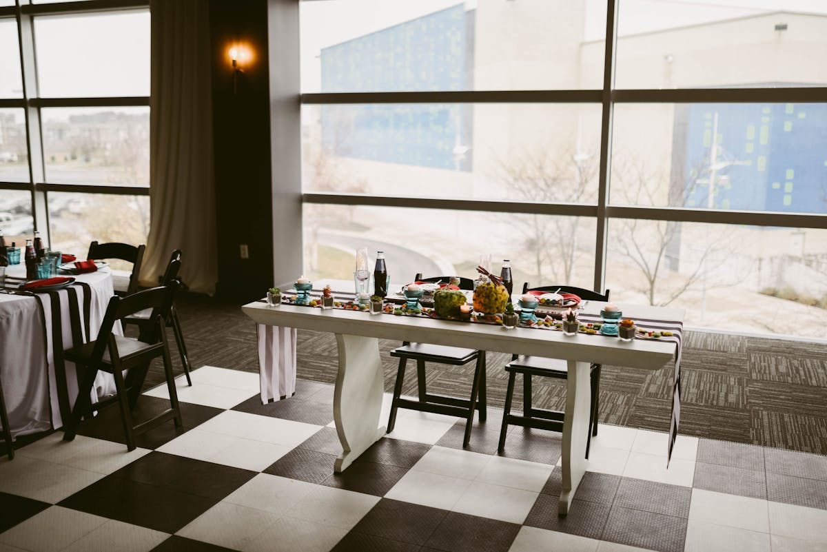 a dining room table in front of a window