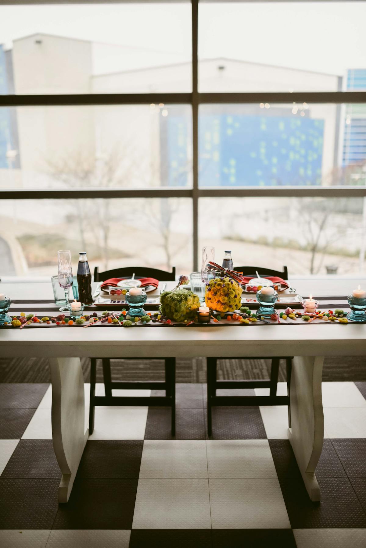 a dining room table in front of a window