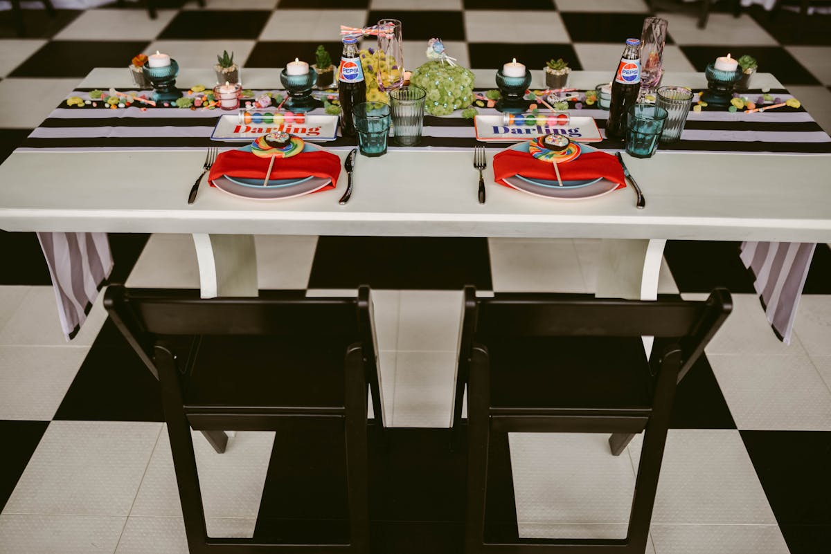 a desk with a laptop on a table