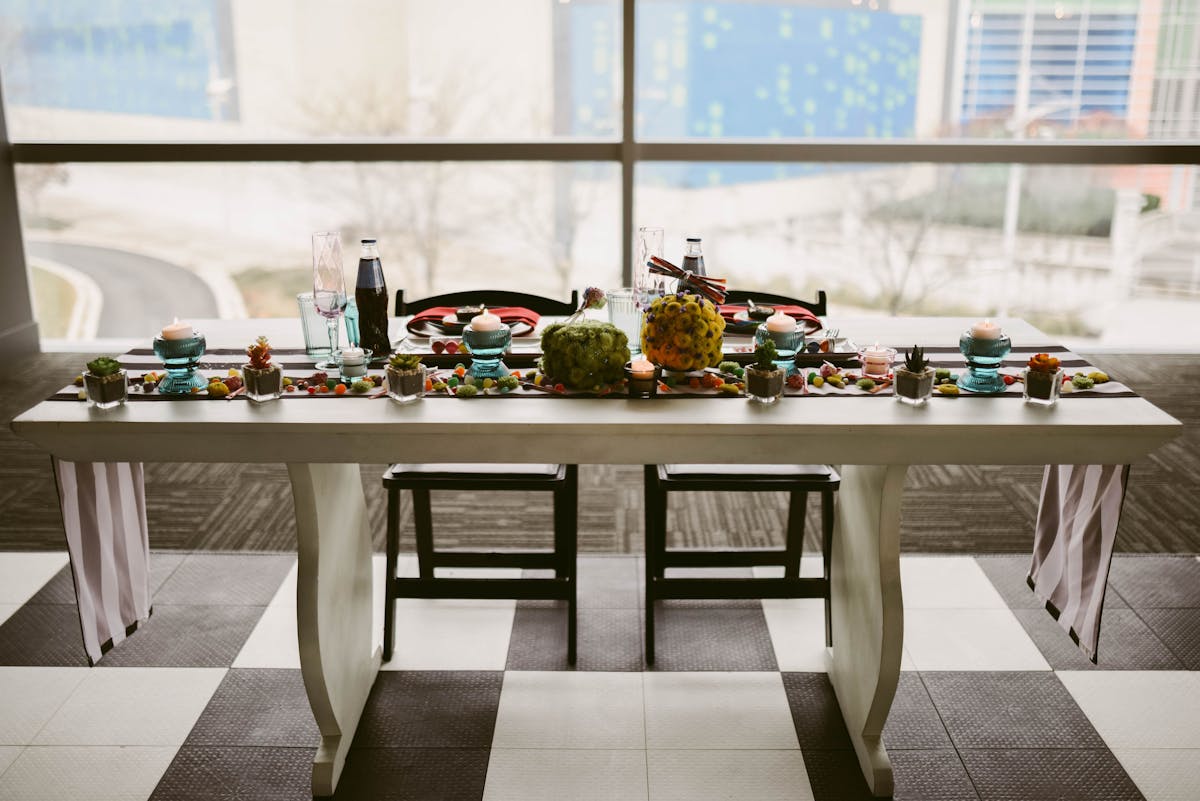 a dining room table in front of a window