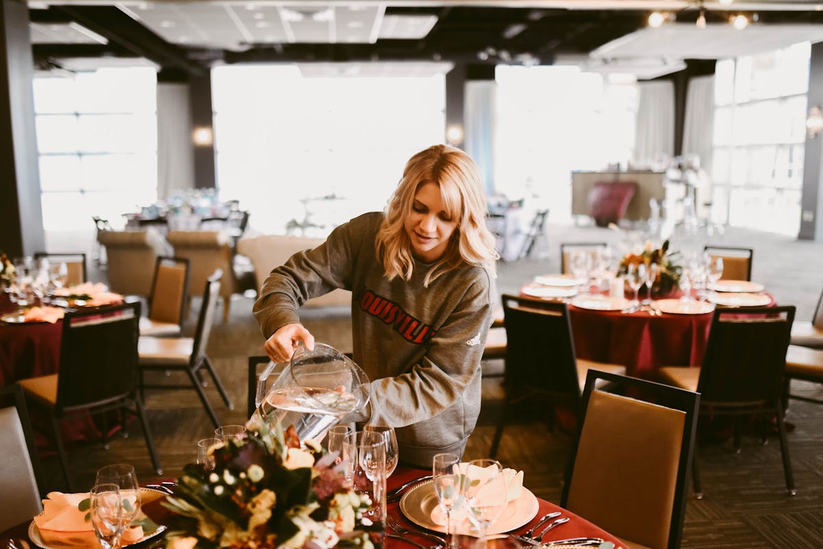 a person sitting at a table in a restaurant