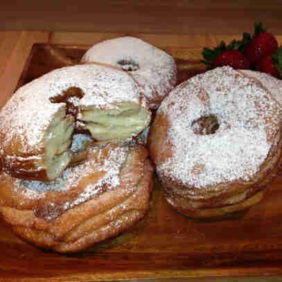 a doughnut sitting on top of a wooden table