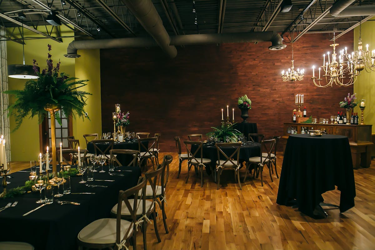 a room filled with furniture and vase of flowers on a table