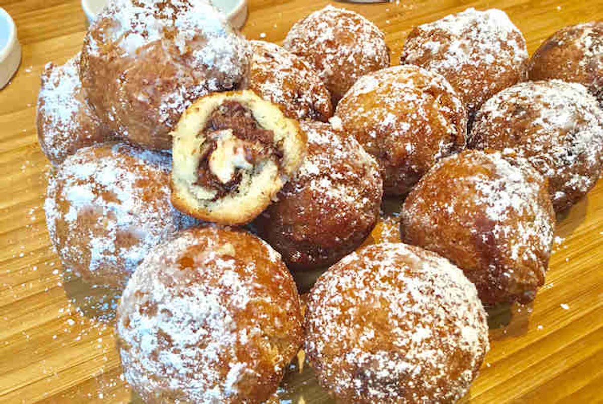 a doughnut sitting on top of a wooden table