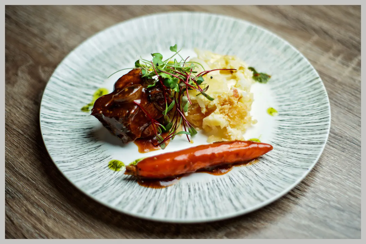 a plate of food sitting on top of a wooden table