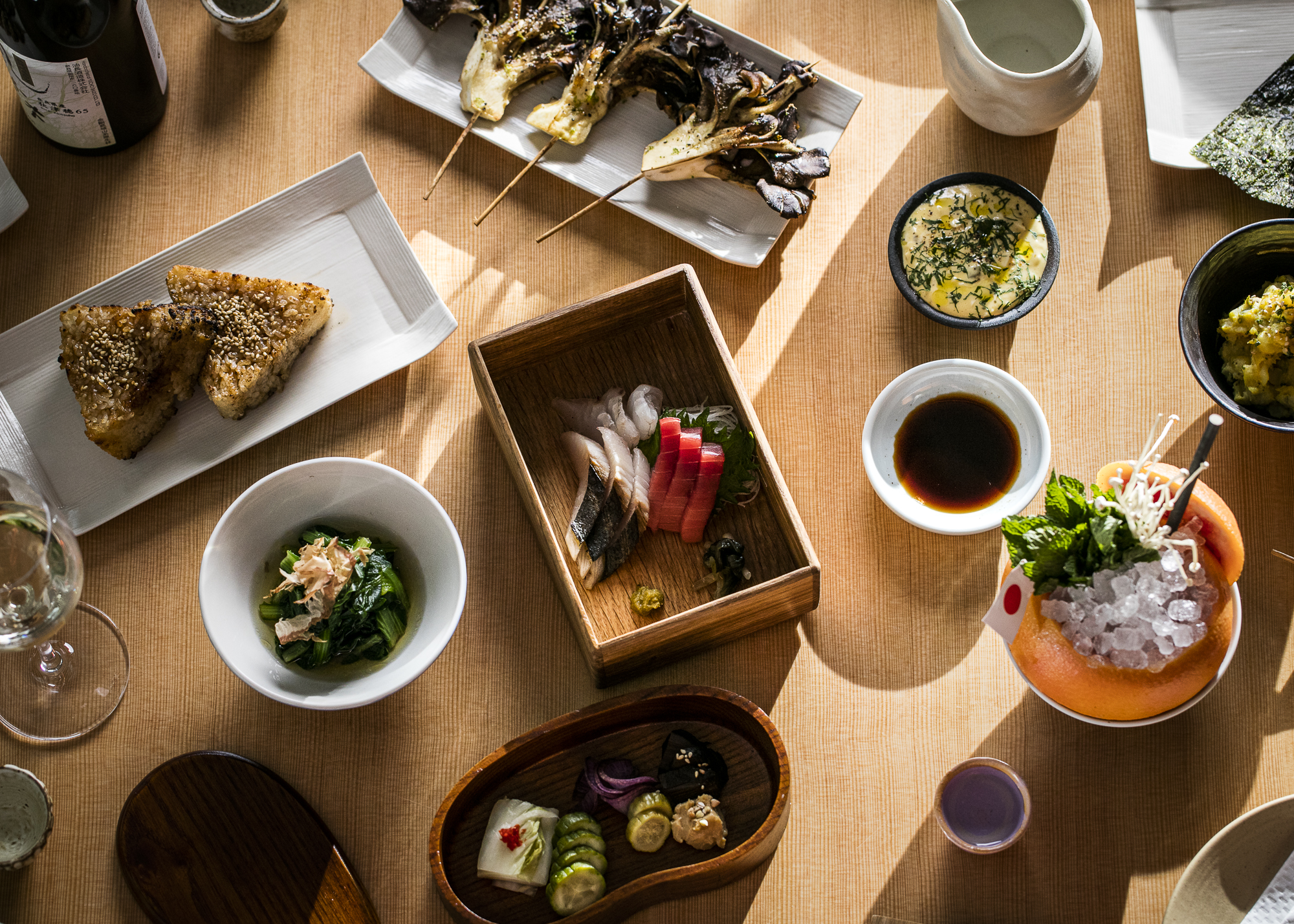 bowls and plates of food on table