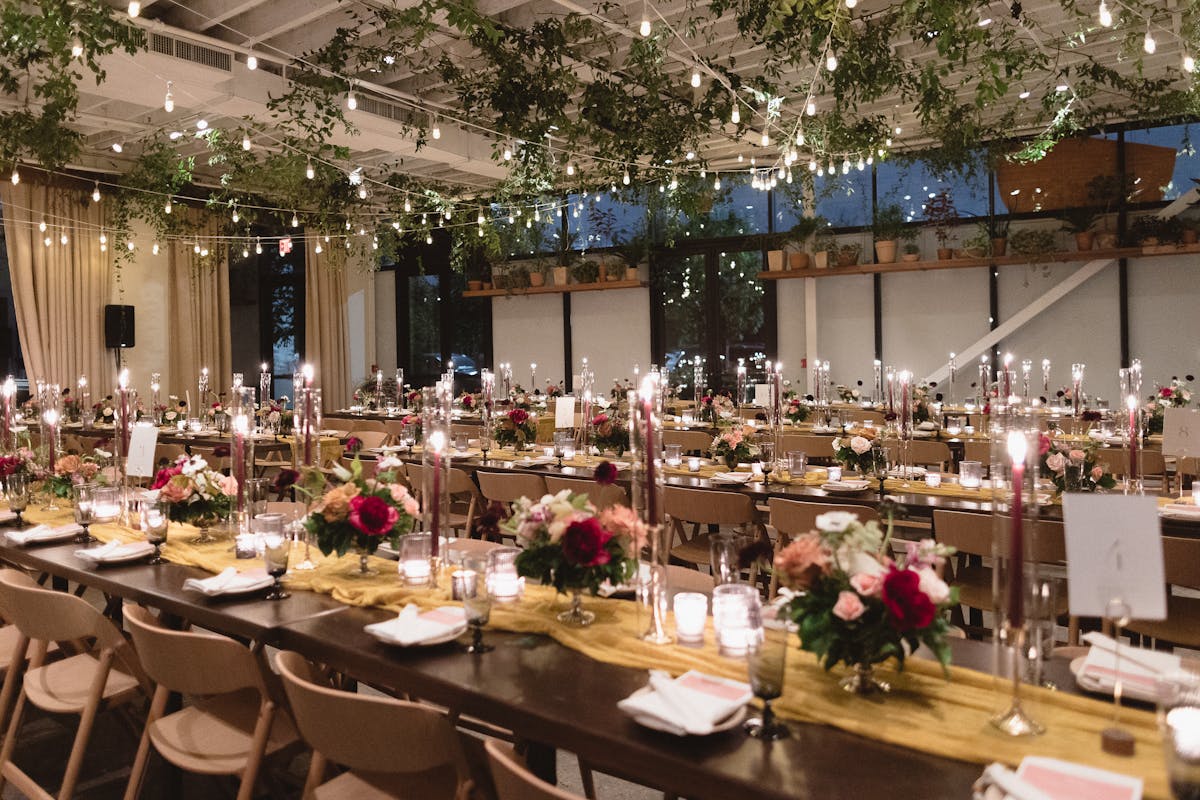 interior of venue decorated with long tables
