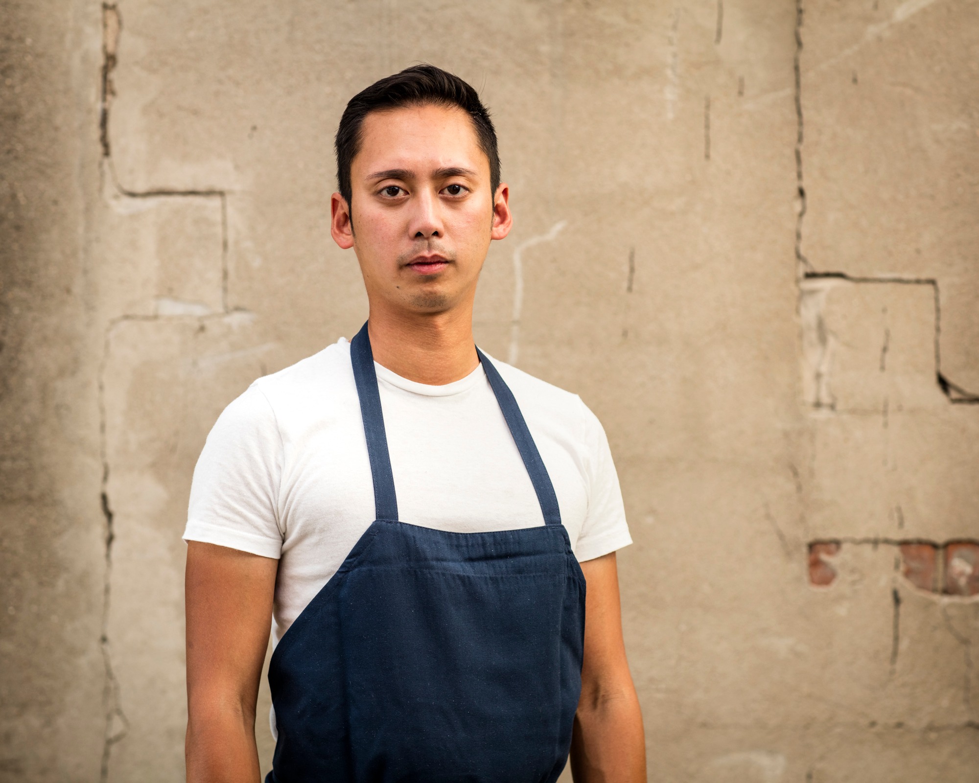 a man standing in front of a building