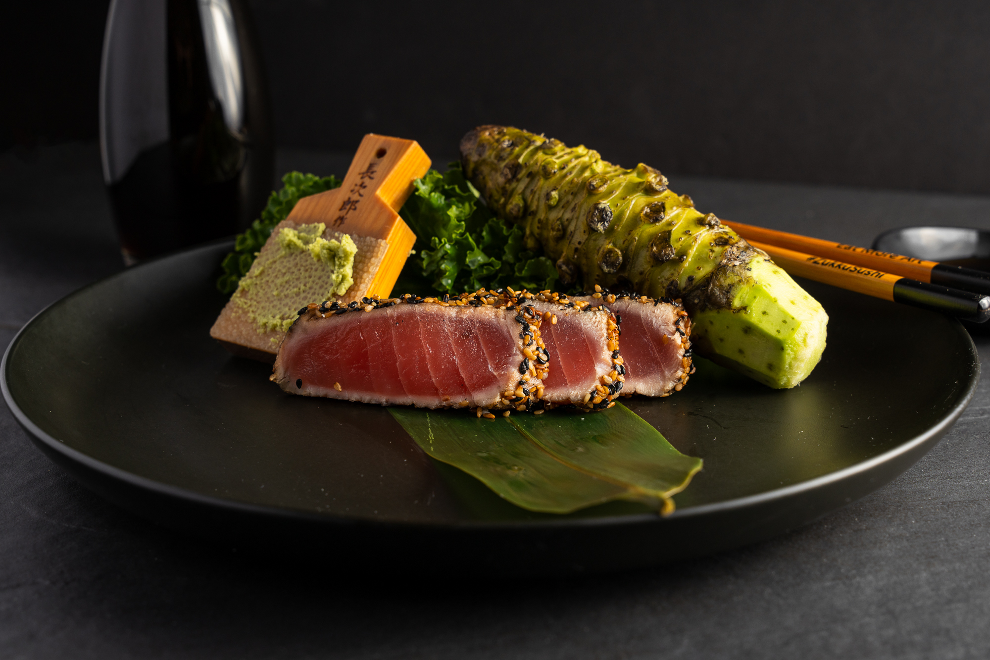 a plate of food with chopsticks