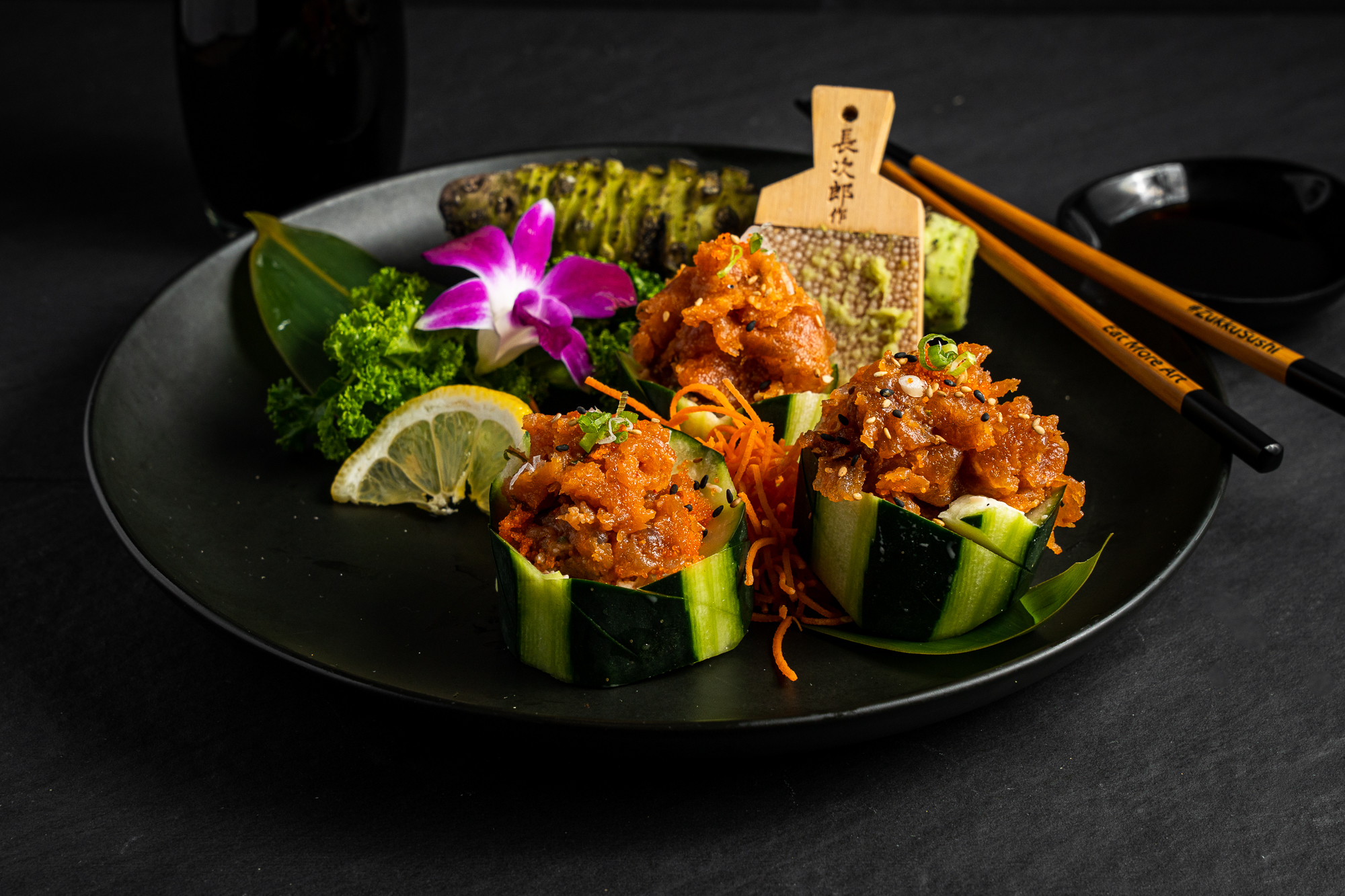 a plate of food with chopsticks