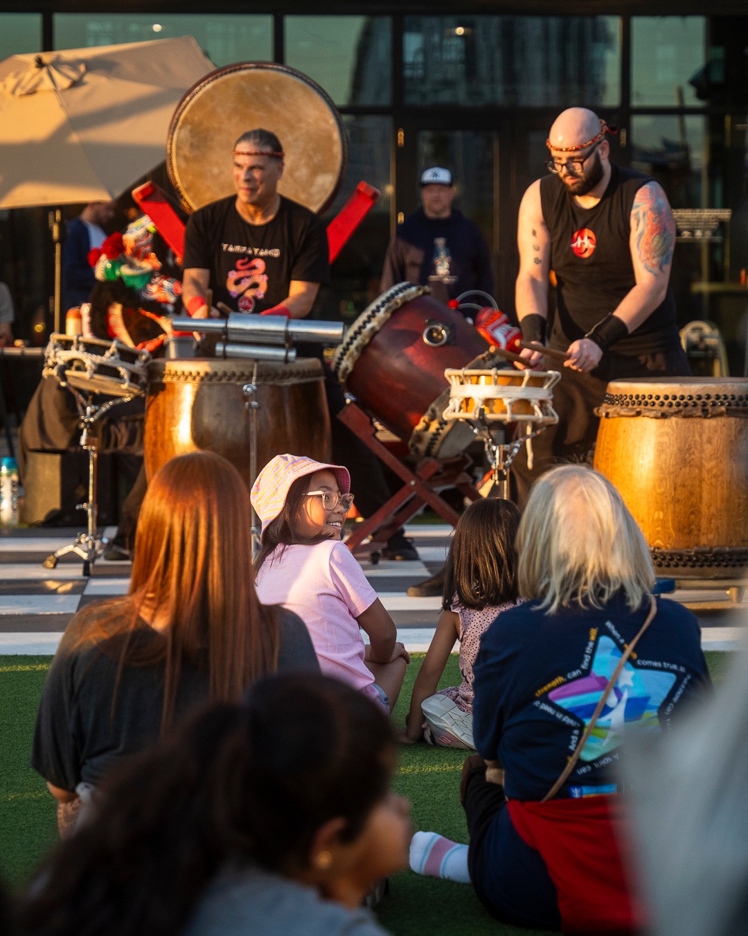 a group of people sitting at a table with wine glasses