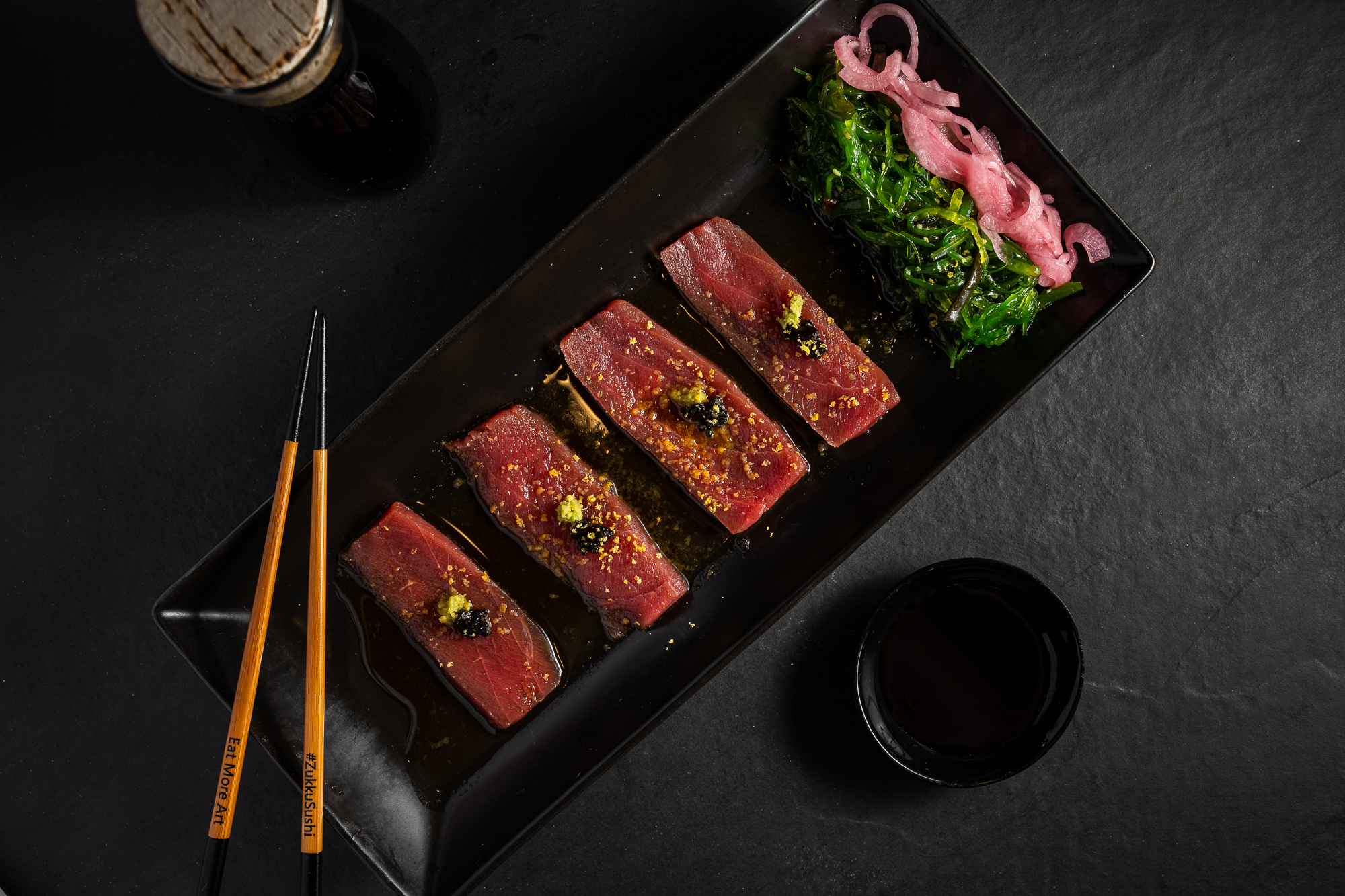 a plate of raw meat and vegetables