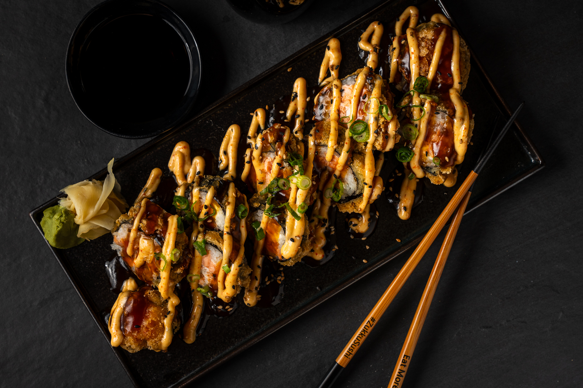 a plate of food with chopsticks