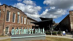 a sign in front of a building