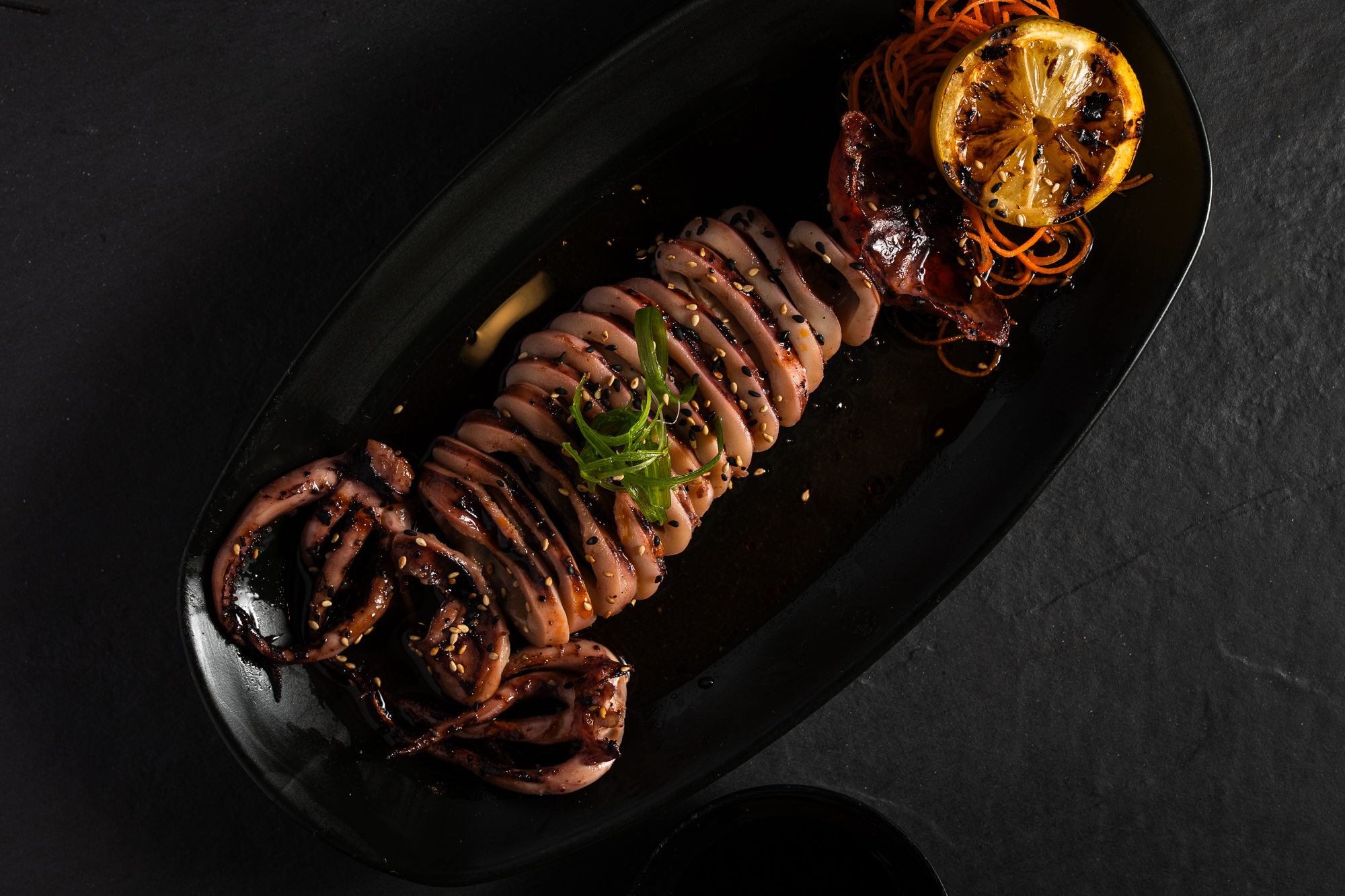 a plate of food with a slice of lemon