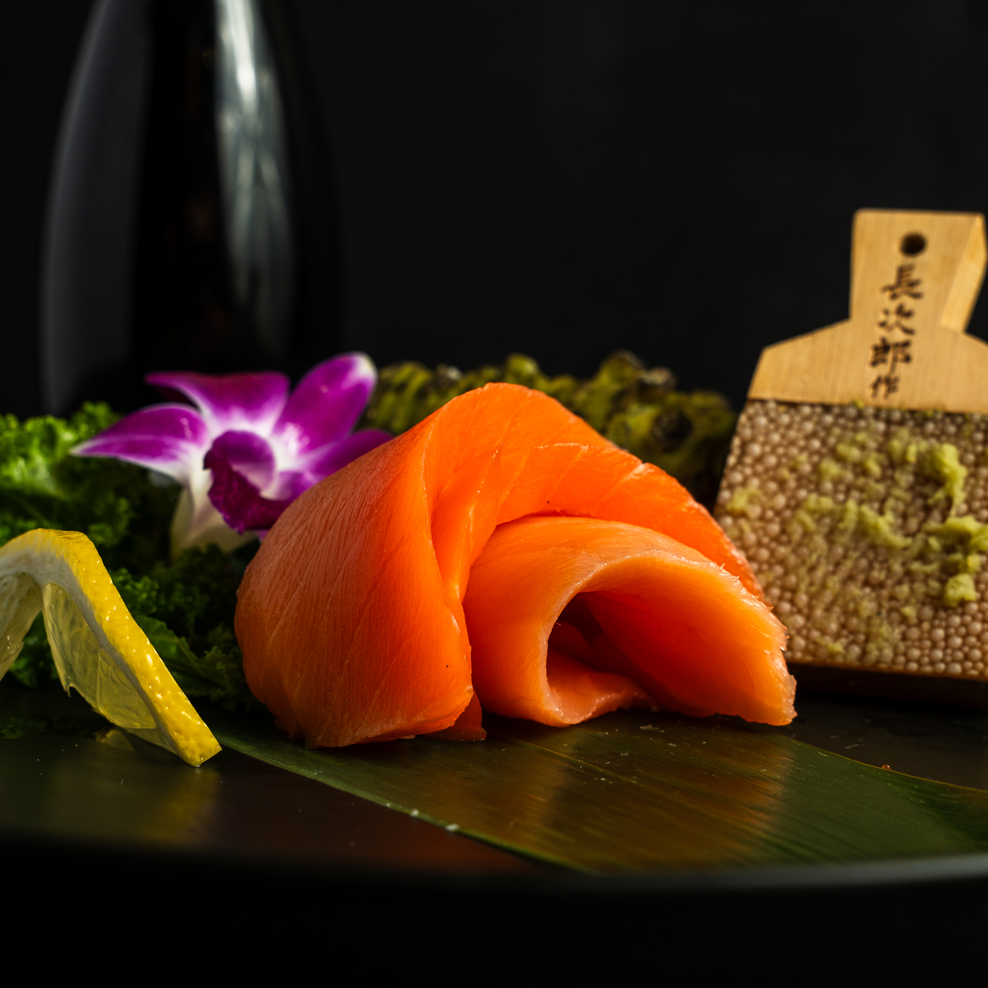 a plate of food on a black surface