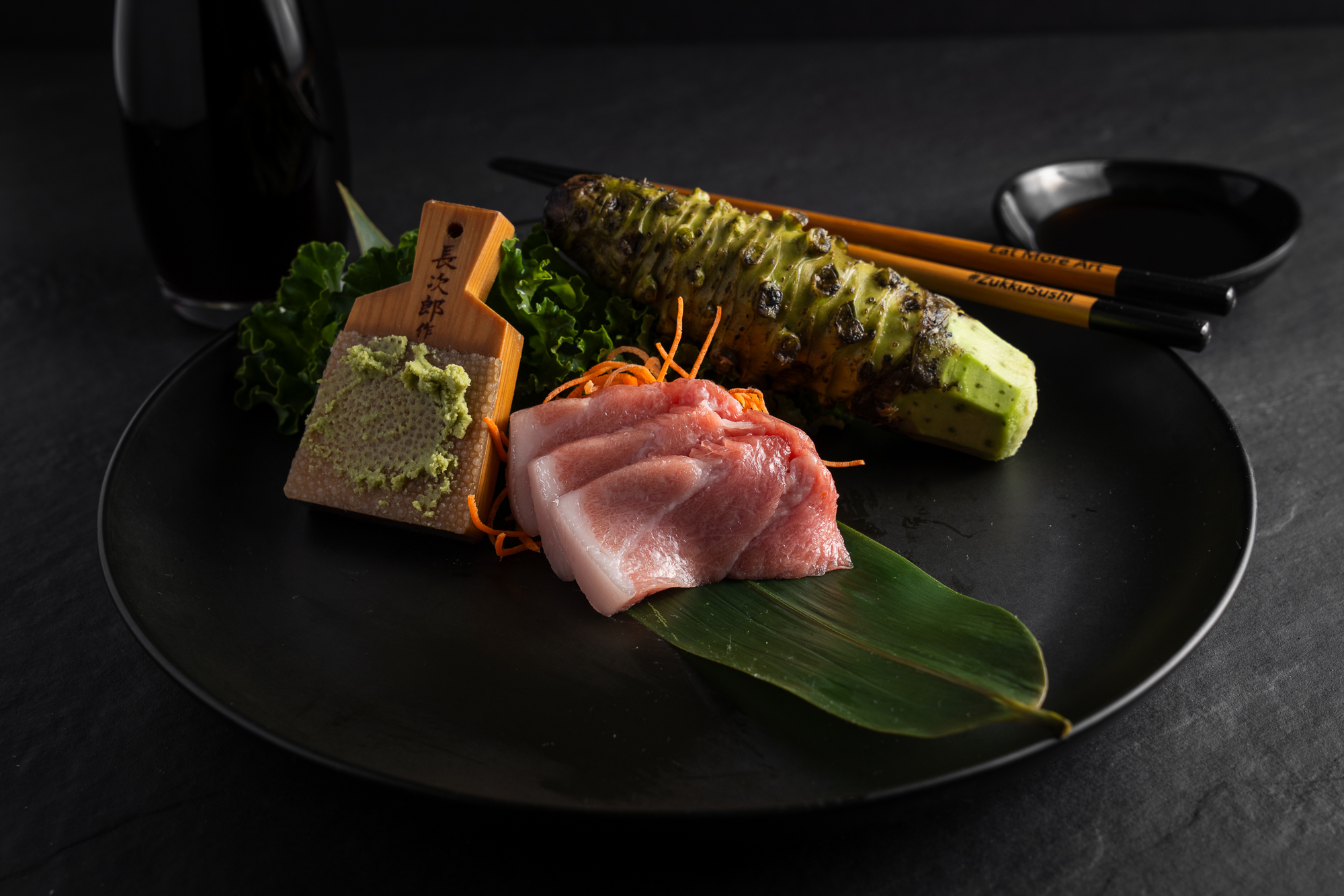 a plate of food with chopsticks and chopsticks