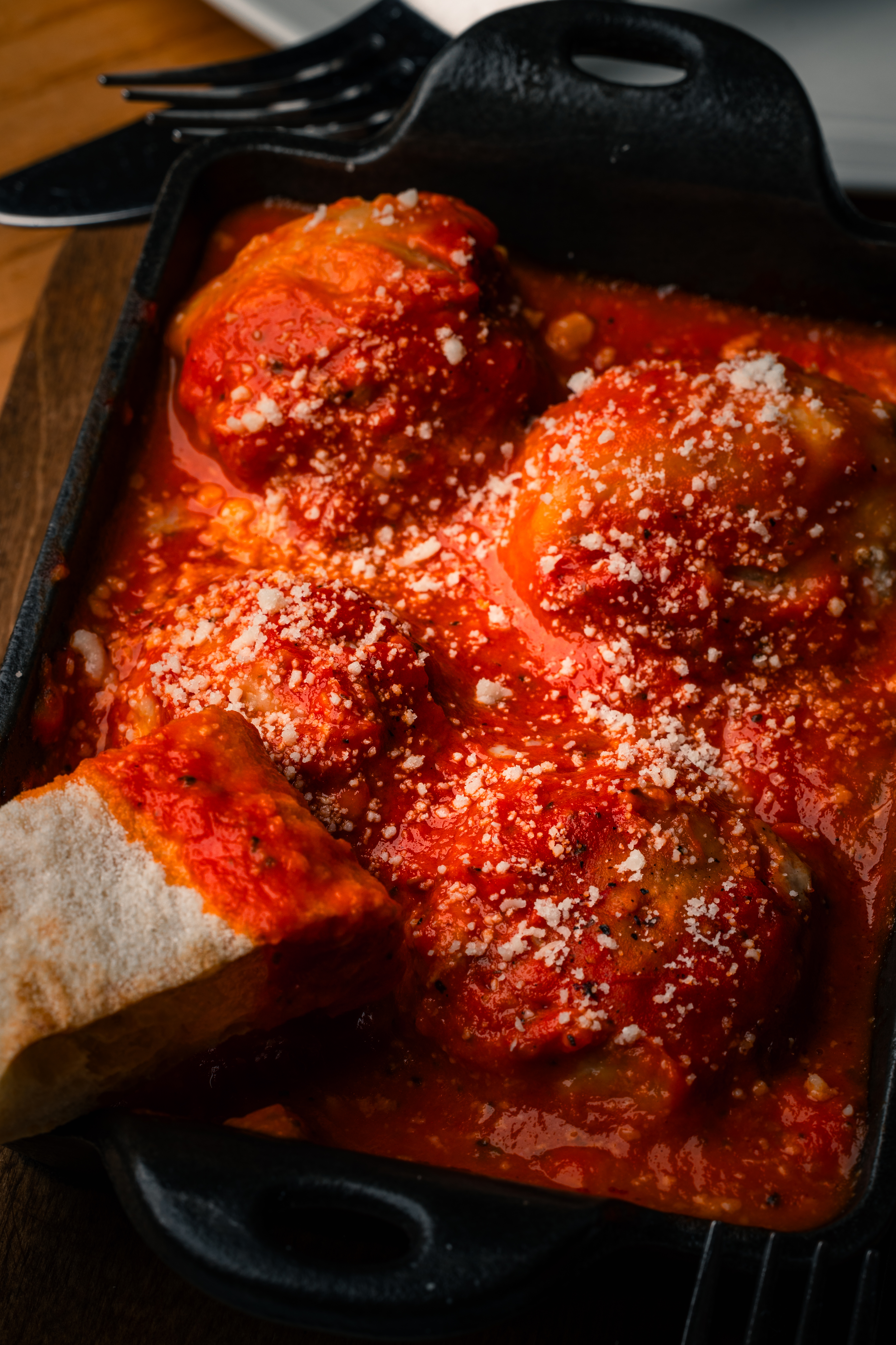 a pizza sitting on top of a wooden table