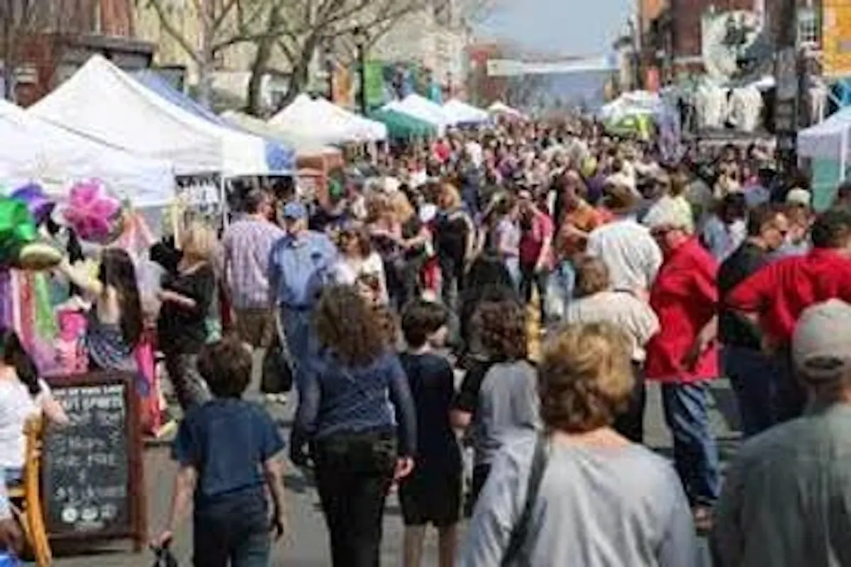 a group of people walking in front of a crowd