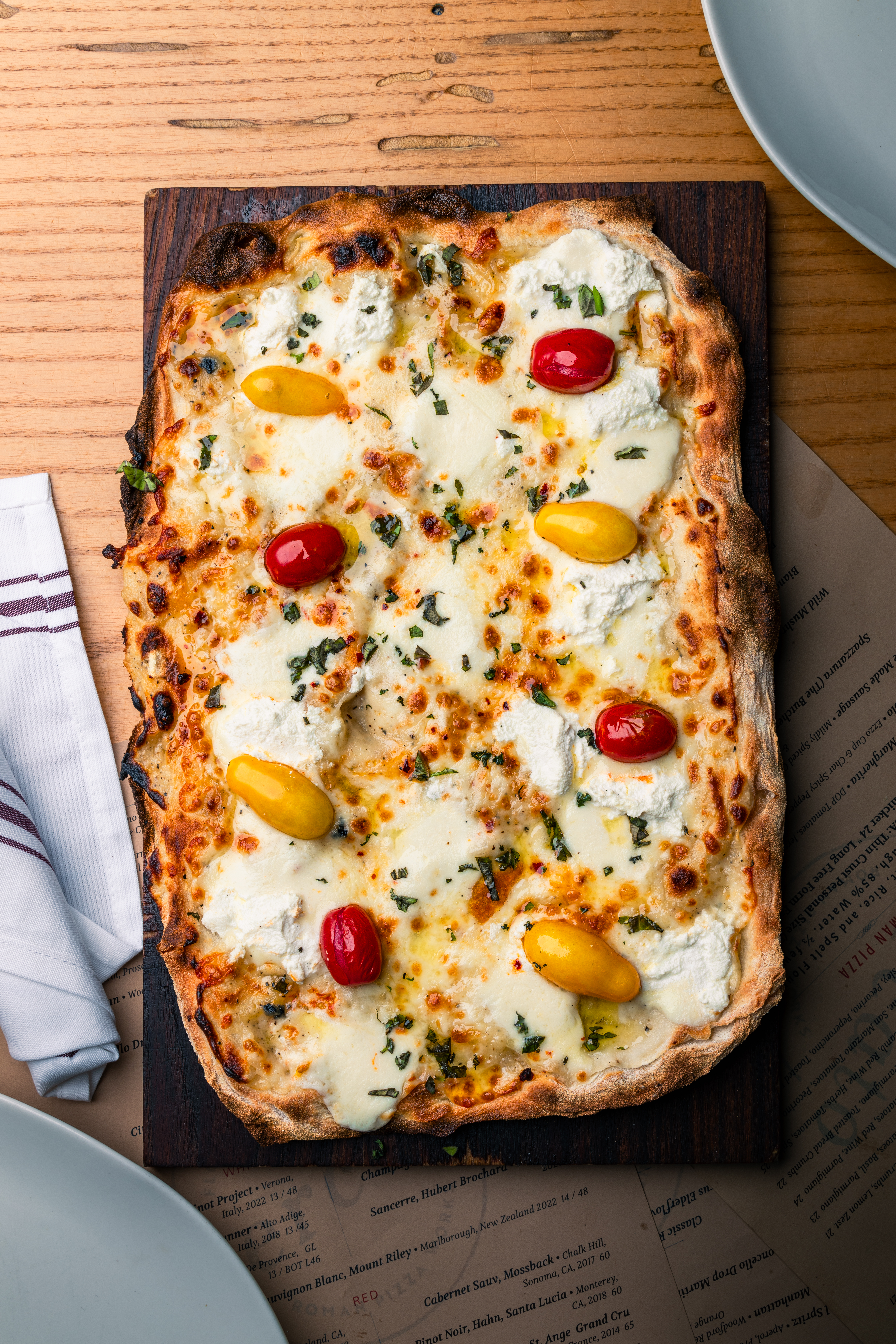 a slice of pizza sitting on top of a wooden table