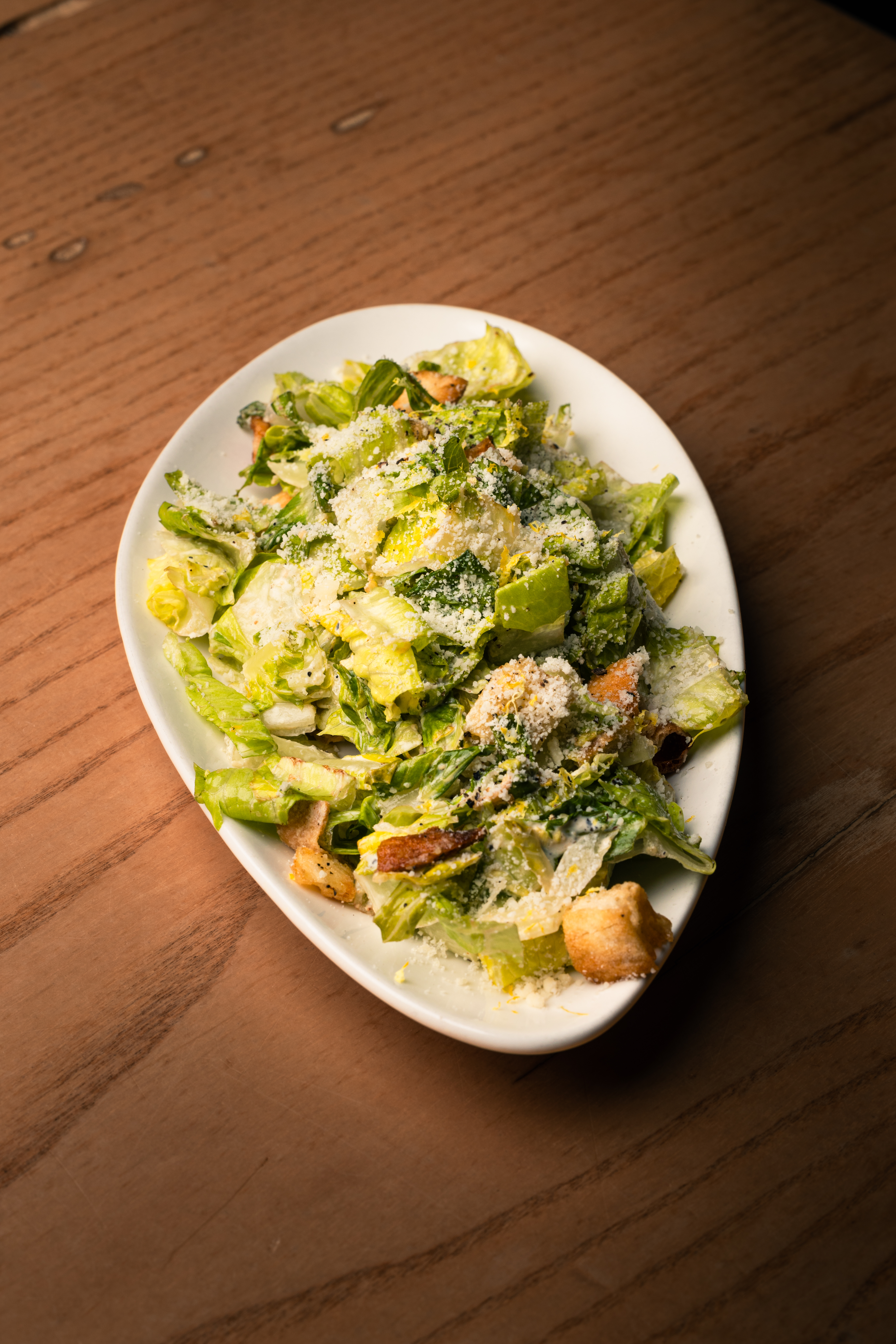 a plate of food sitting on top of a wooden table
