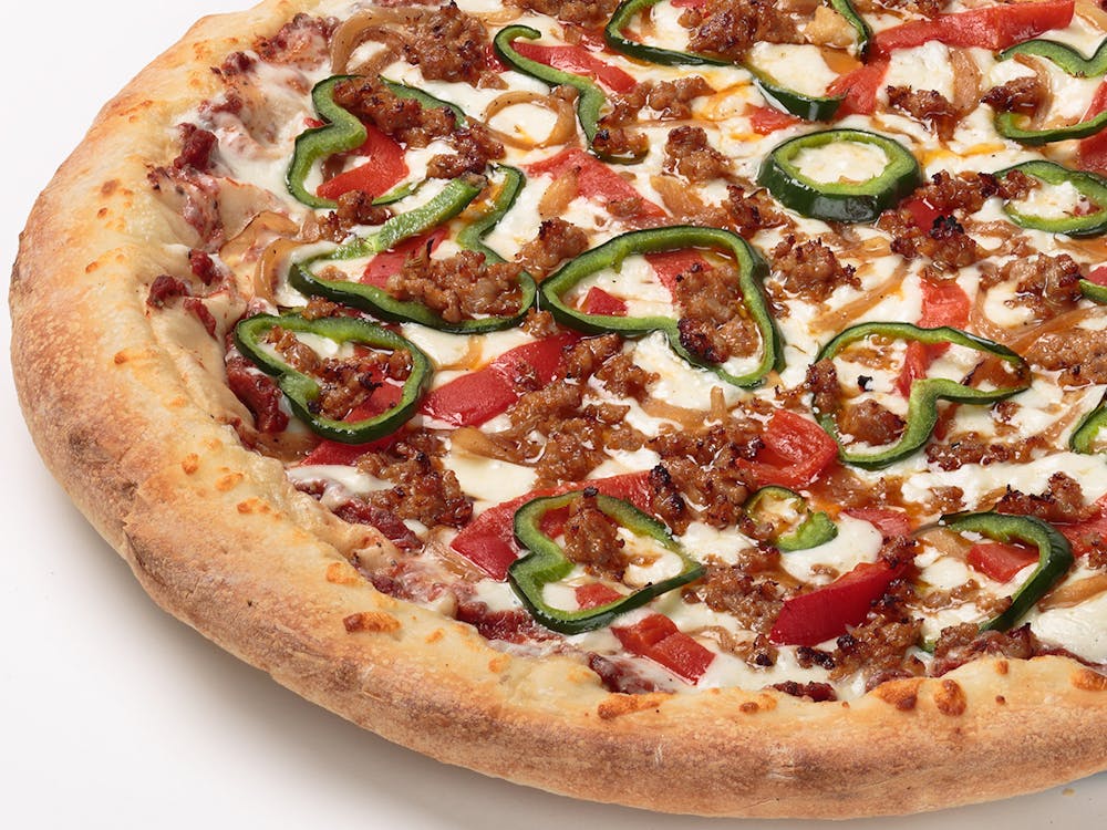 a pizza sitting on top of a plate of food