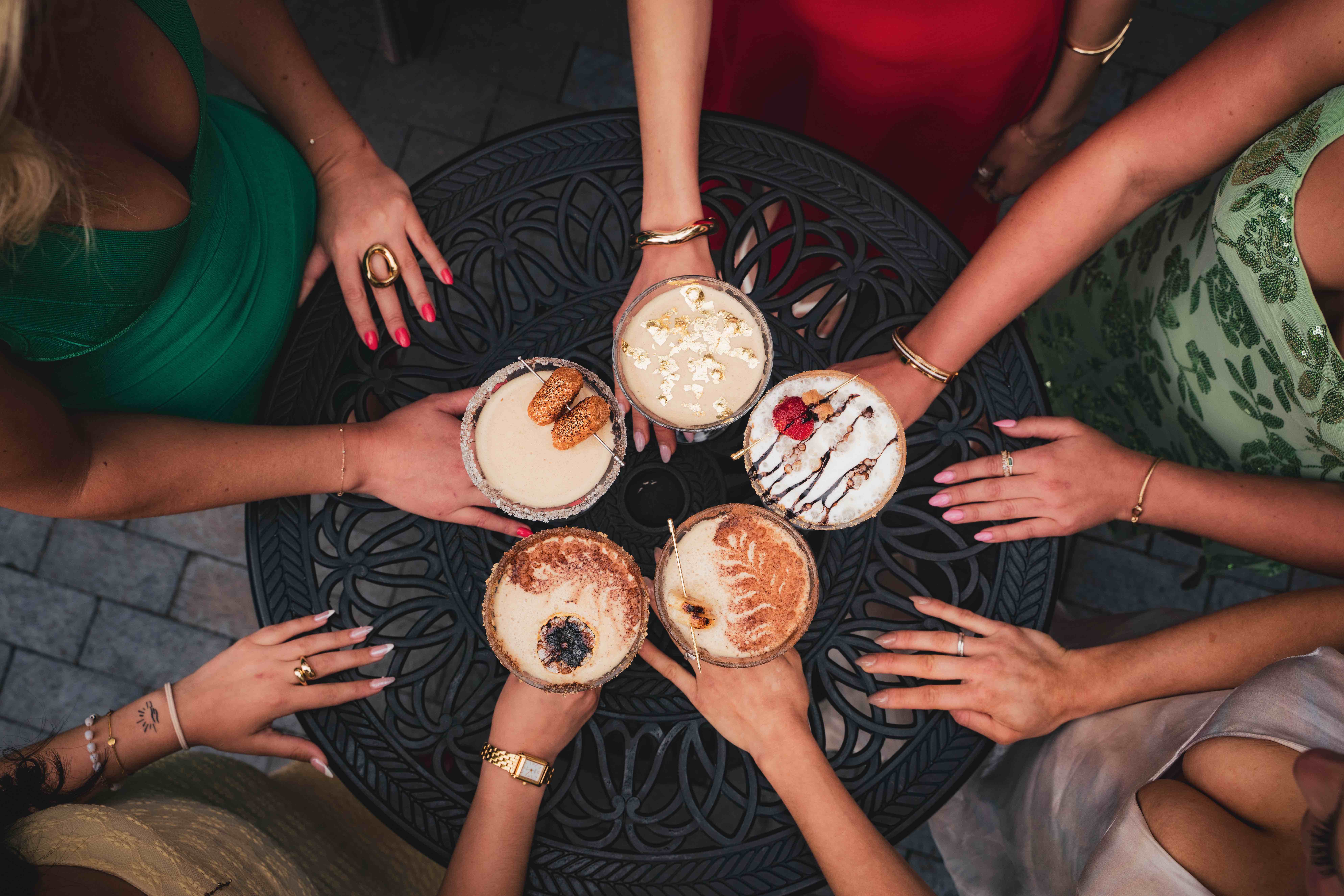 a group of people holding drinks