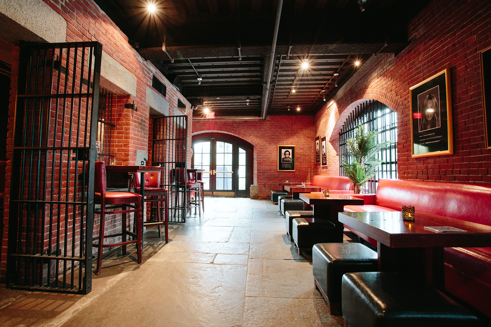 a living room filled with furniture and a brick building