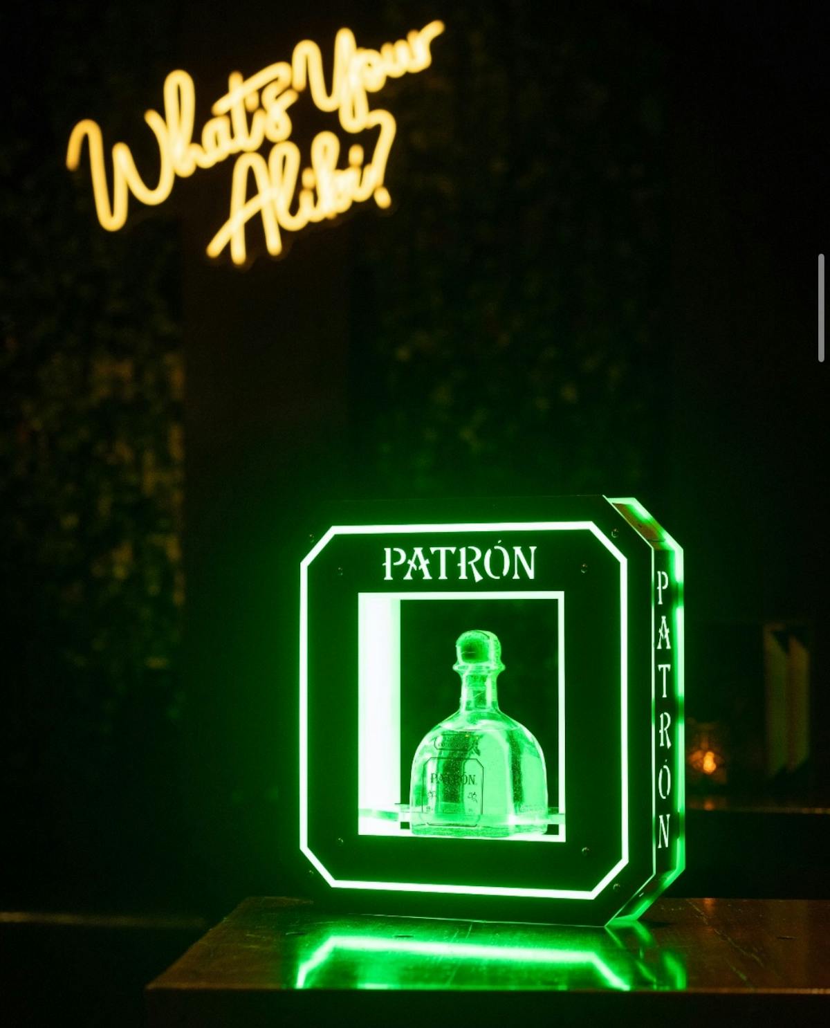 a sign lit up at night