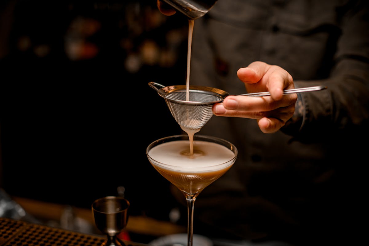 a person holding a wine glass