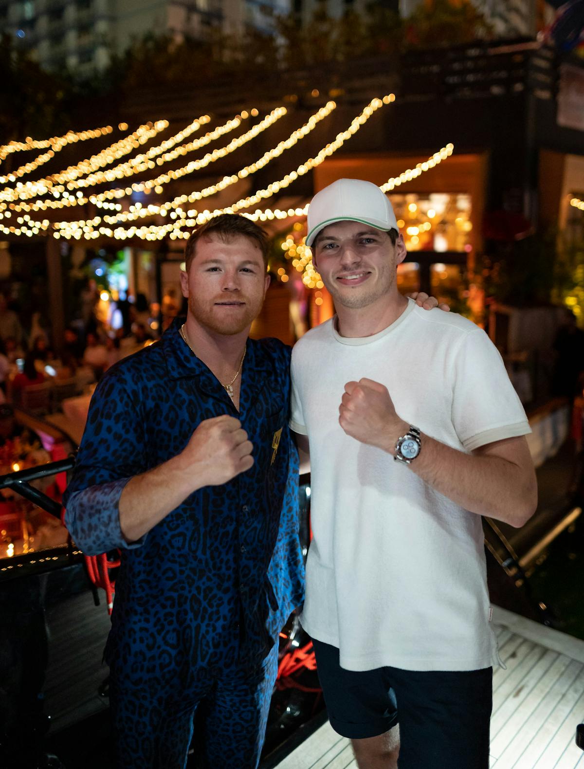 Saul Alvarez, Max Verstappen standing next to a man