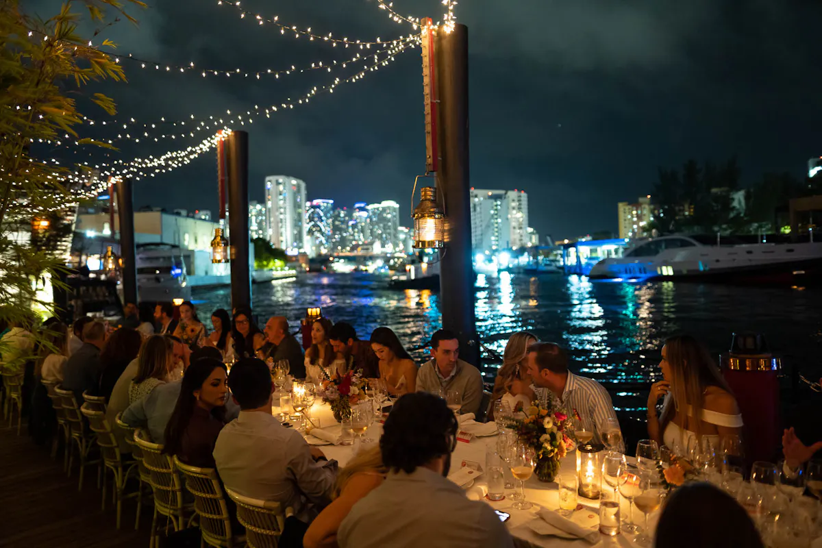 a group of people sitting at a table in a restaurant