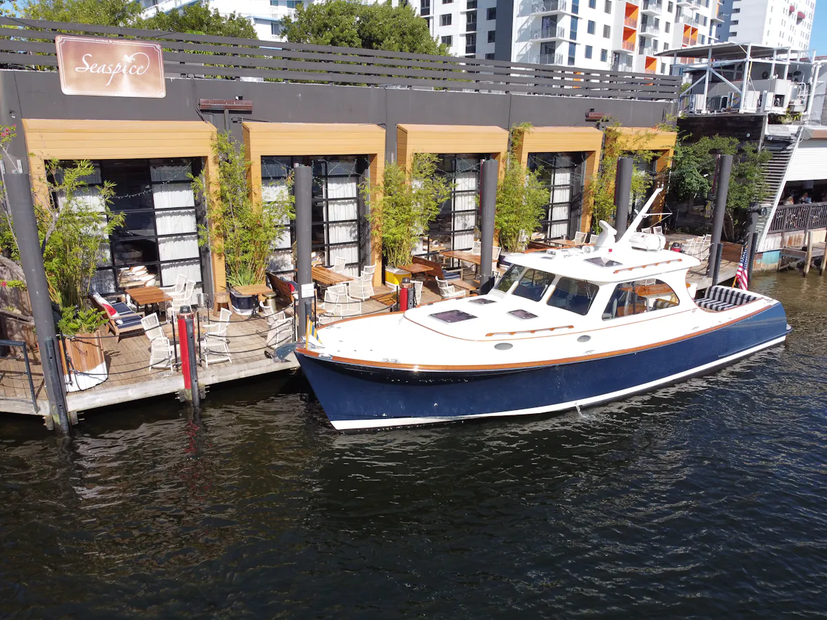 a boat is docked next to a body of water