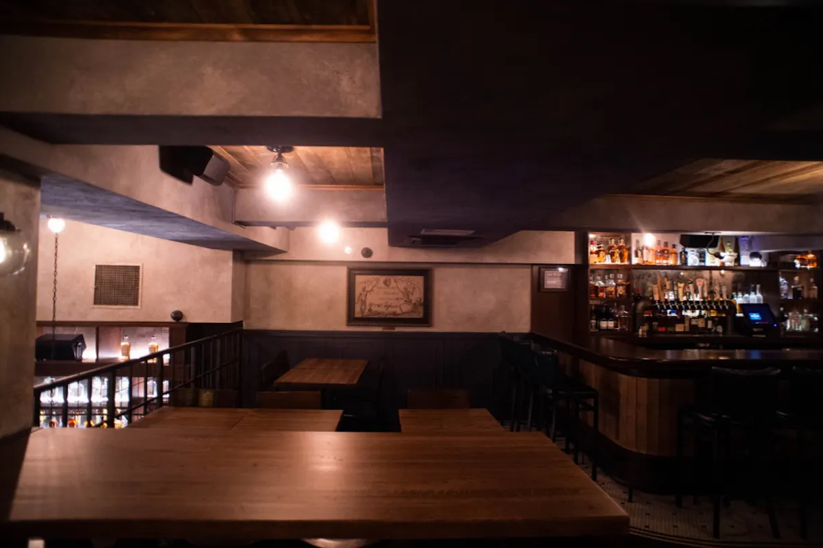 a kitchen with a table in a dark room