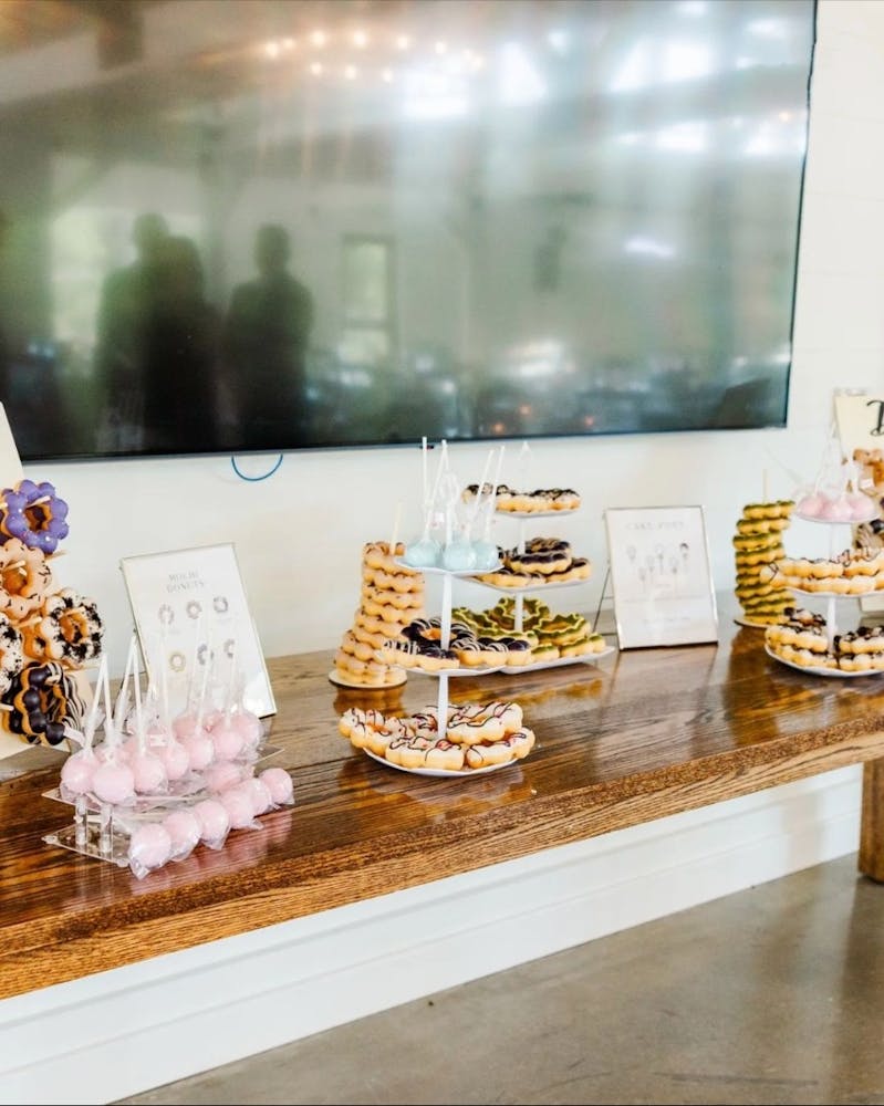 a vase of flowers on a table next to a glass display case