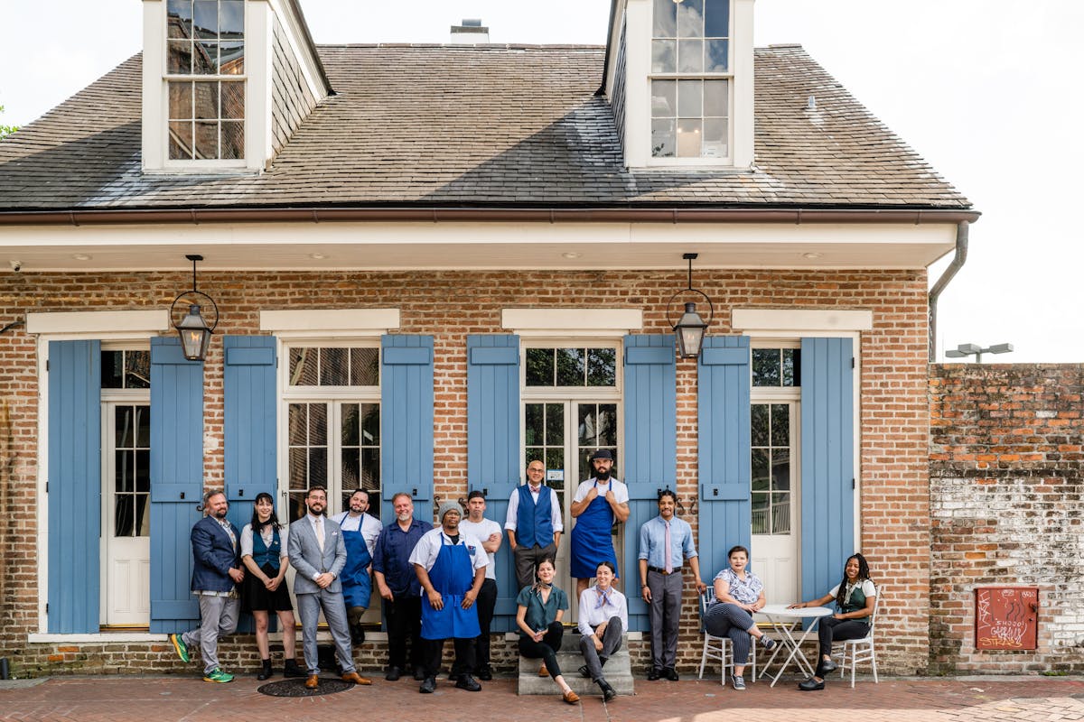 a group of people standing in front of a building