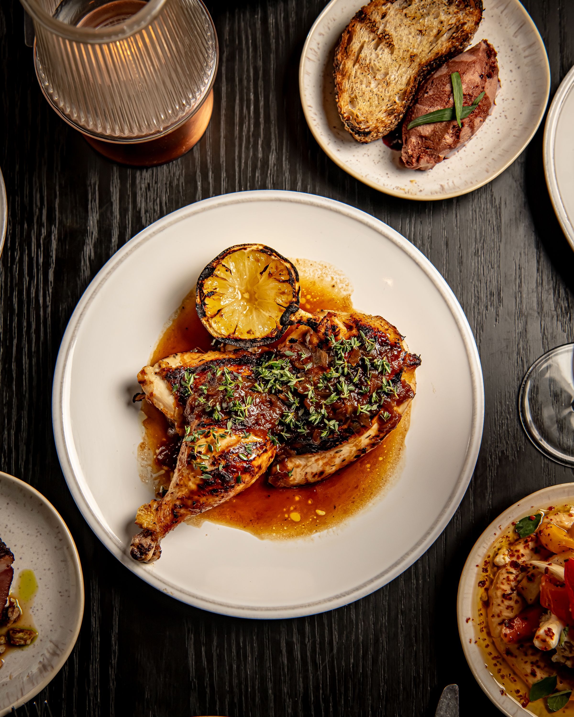 a bowl of food on a plate on a table