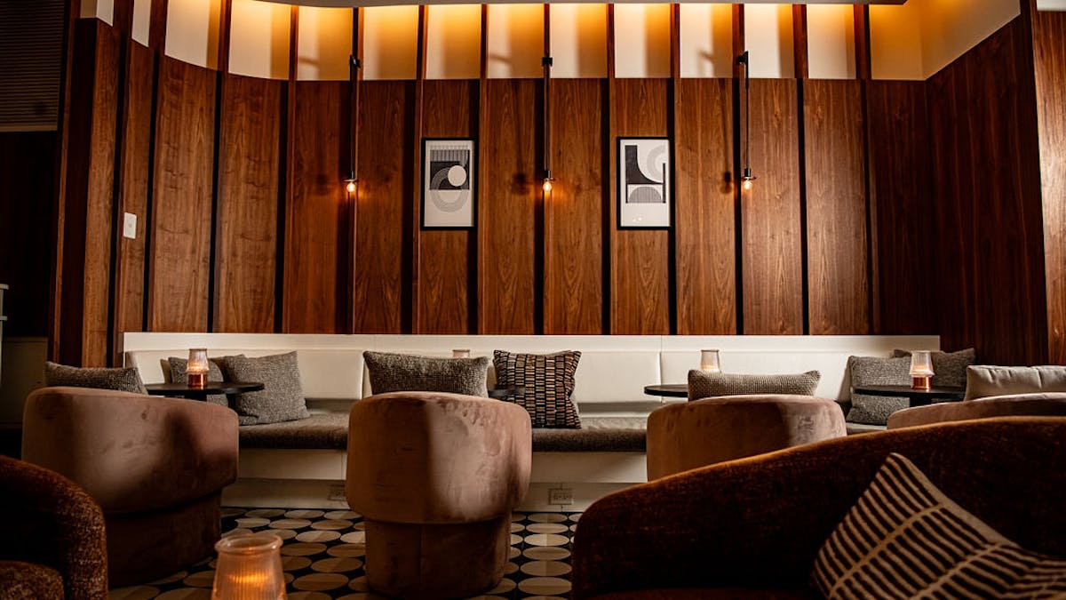 a living room filled with furniture and a large window