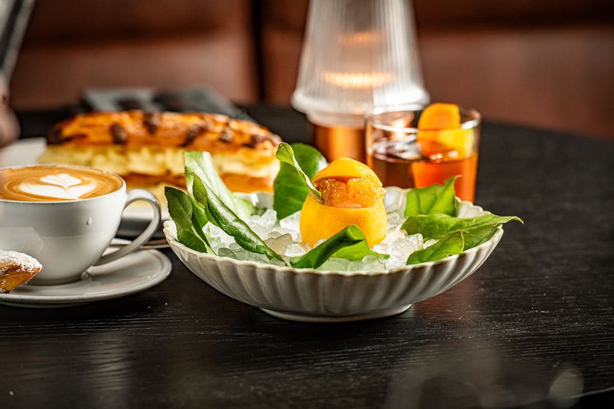 a bowl of food on a plate on a table