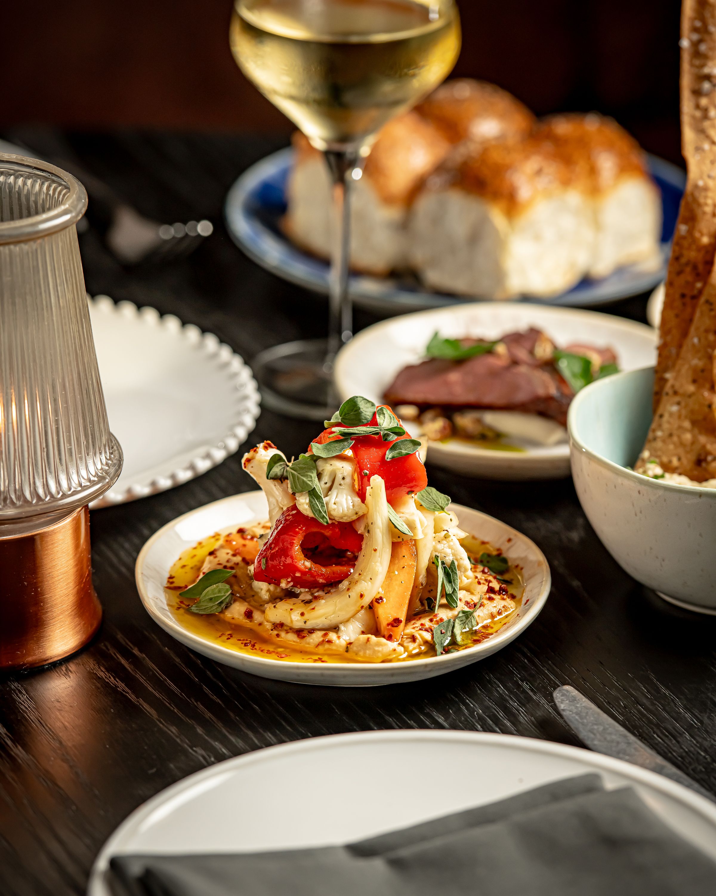 a table topped with plates of food on a plate