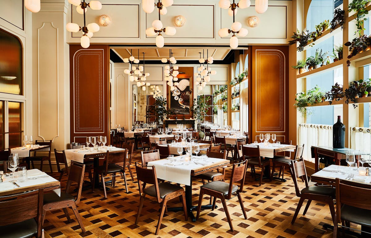 a dining room table in front of a window